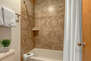 Main Level Shared Bathroom with jack-n-Jill access to Main Living Area, dual vanities, and shower/tub combo