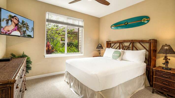 Guest bedroom located on the ground floor with a Queen bed, TV and ceiling fan