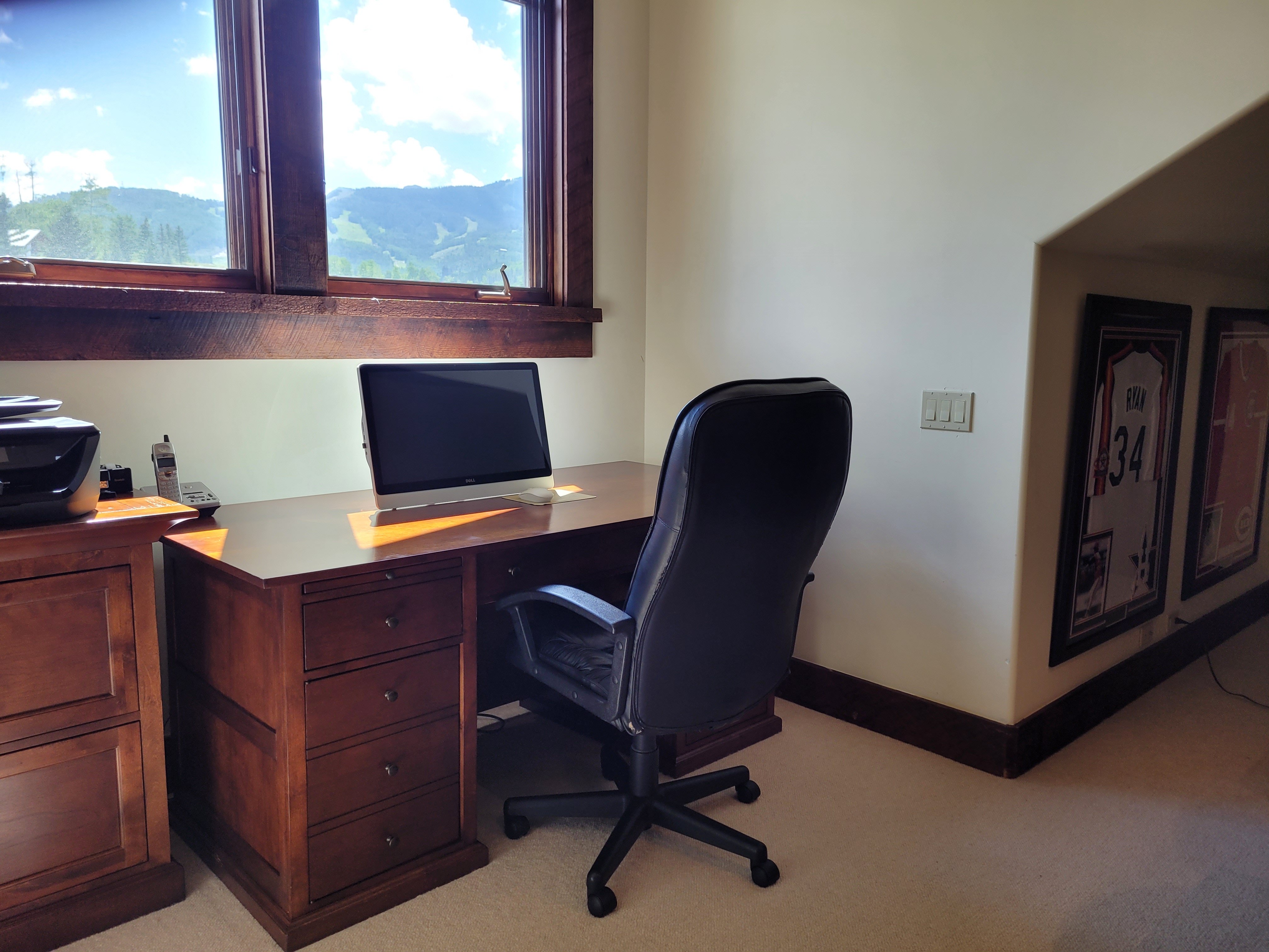 Office with wood desk and office chairs