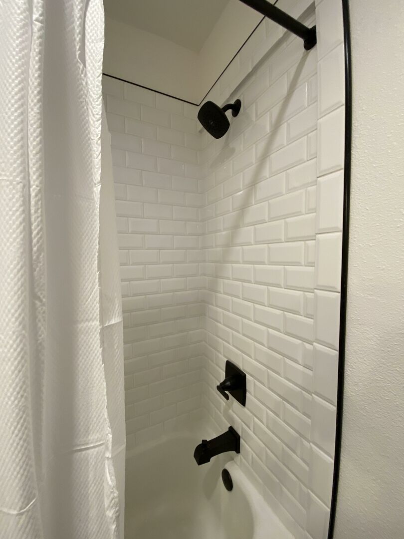 Hall Bath features tiled shower/tub