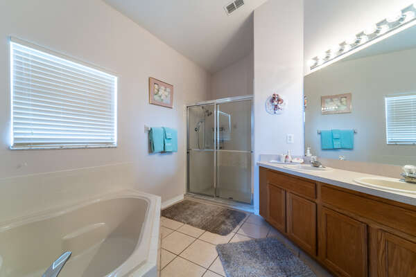 Master bath with stand up shower and tub