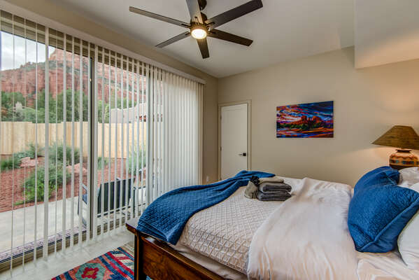 Main Level Master Bedroom with a King Bed and Patio Access