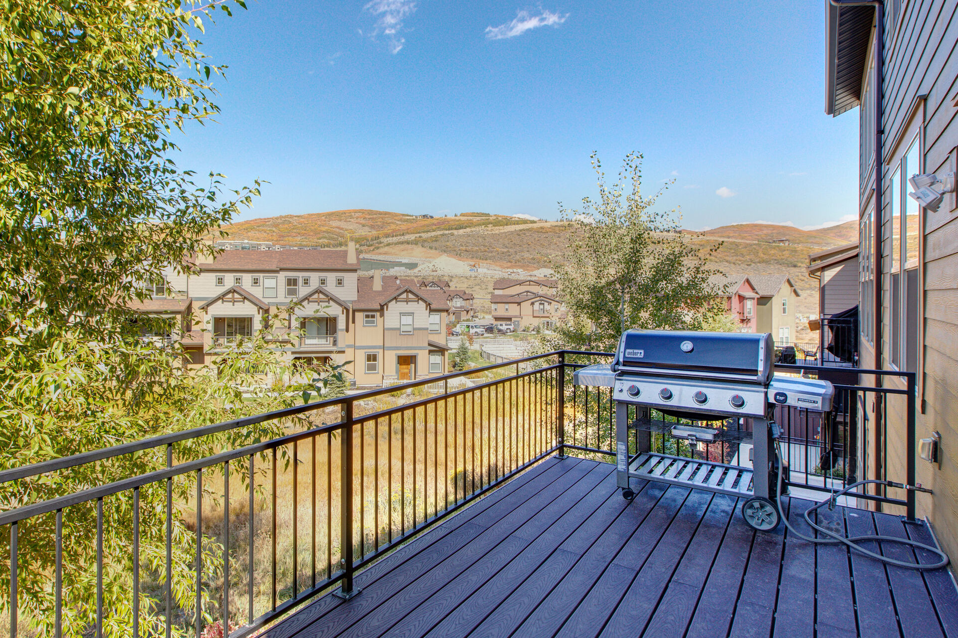 Private deck off main living area with BBQ stove and surrounding views