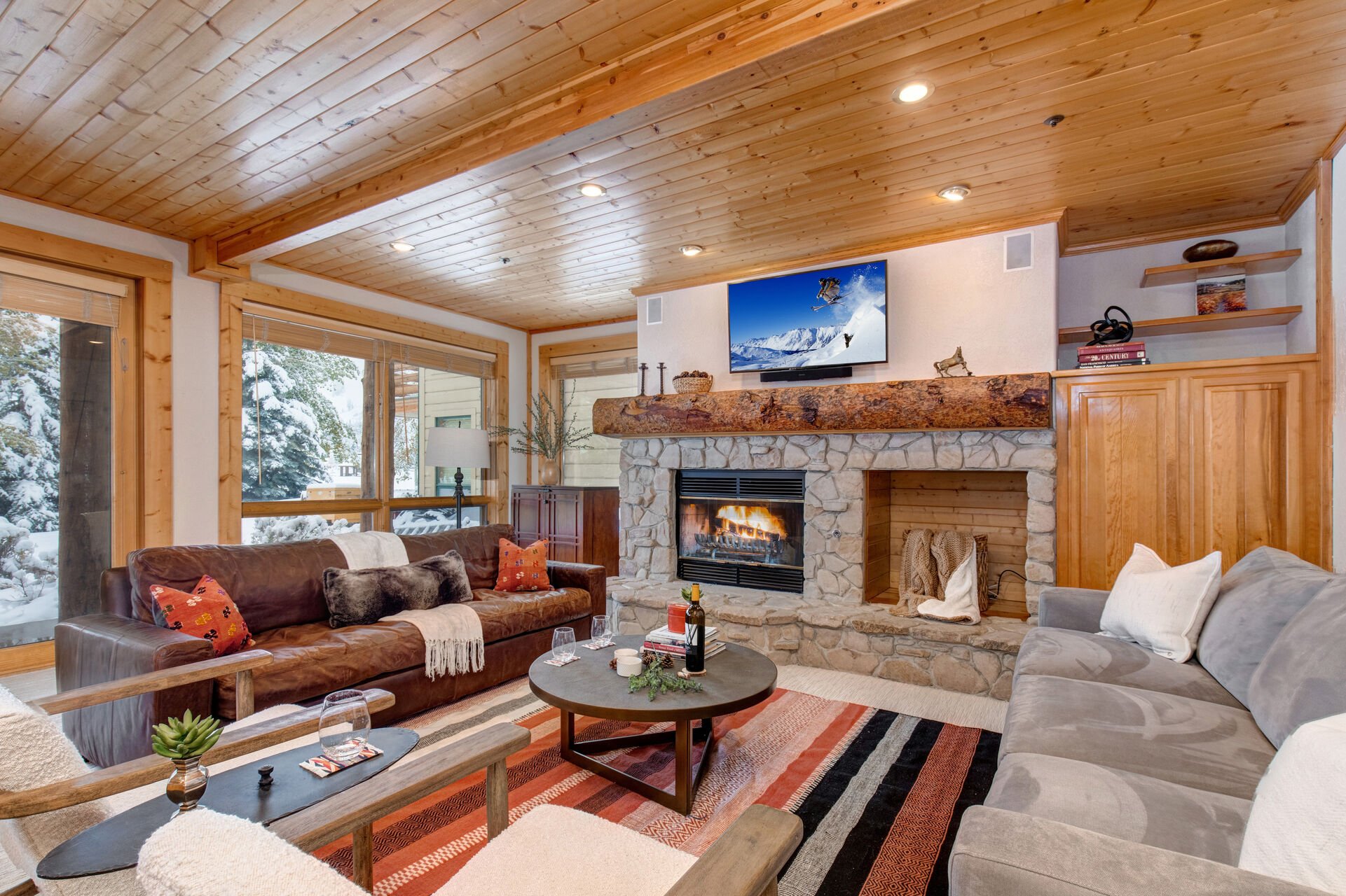 Living Room with abundant plush furnishings, sofa bed, wood burning fireplace, 50