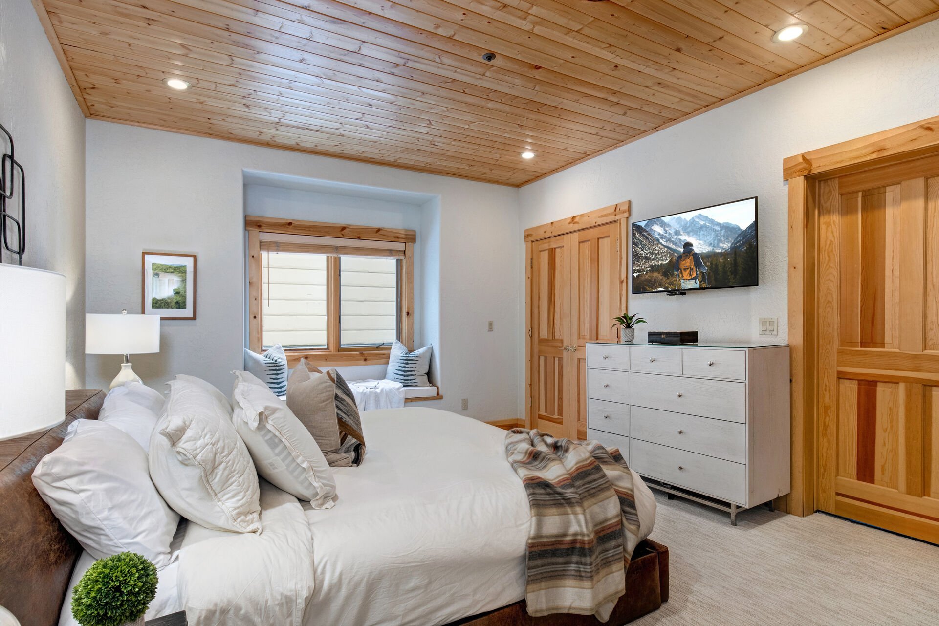 Master Bedroom with king bed, smart tv, and en suite bathroom