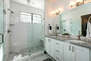 Main Level Master Bathroom 2 with dual vanities, over sized tile shower and private washroom