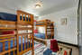 Upper Level Bunk Room with two twin over twin bunk beds and full bath access