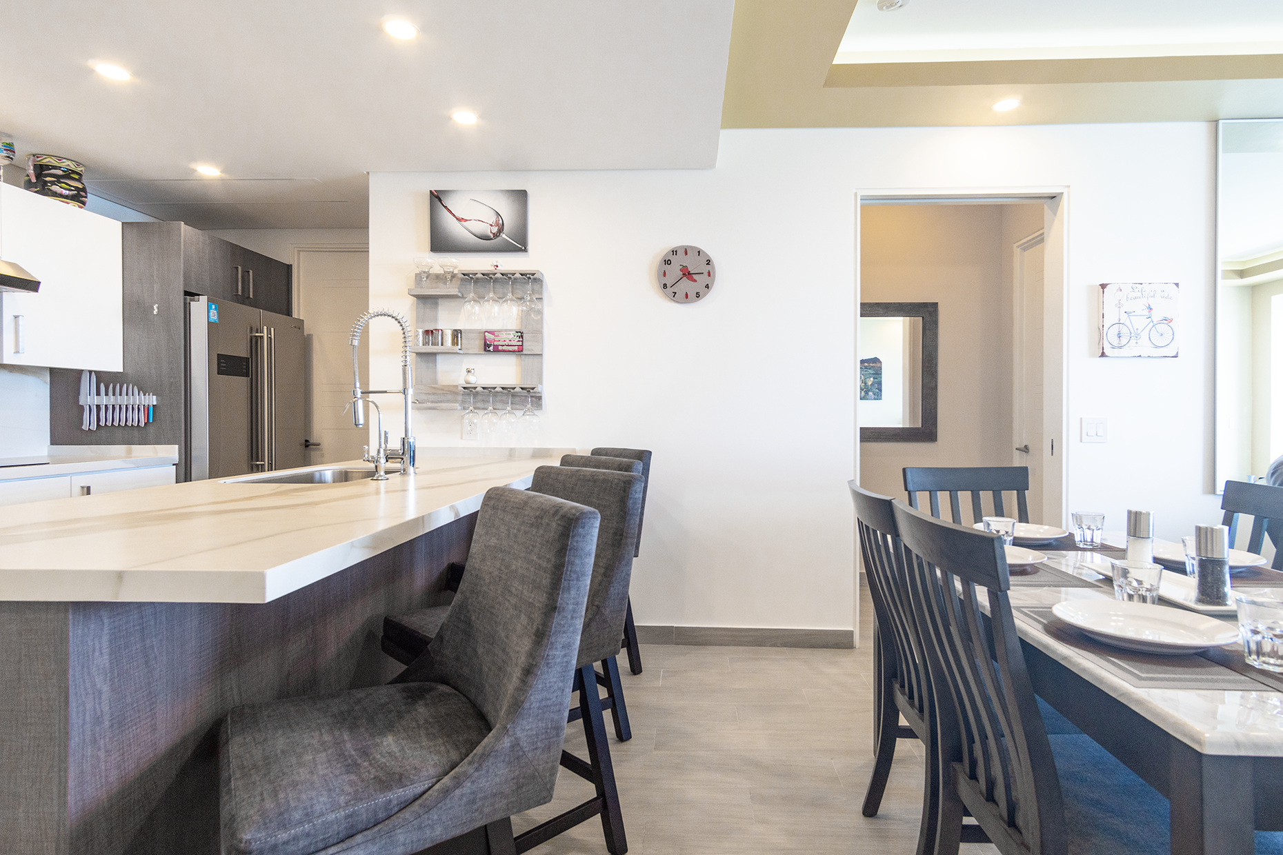 kitchen and dining table with bar stools