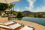 lounge by the pool in these chaise chairs or take a dip and enjoy the picturesque view