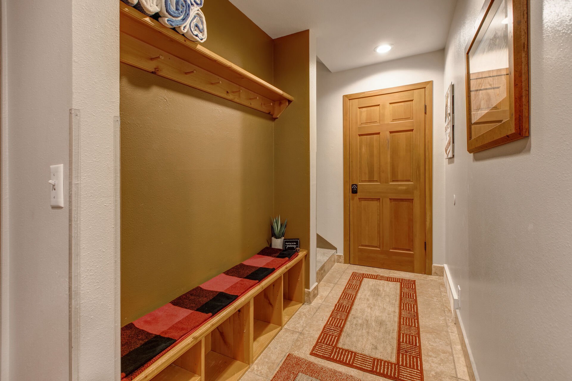 Lower Level Garage Entryway with mudroom and equipment storage
