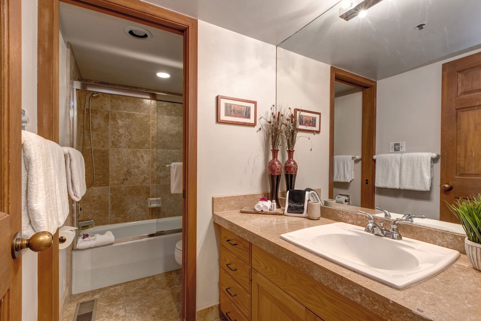 Main Level Shared Full Bathroom with tub/shower combo