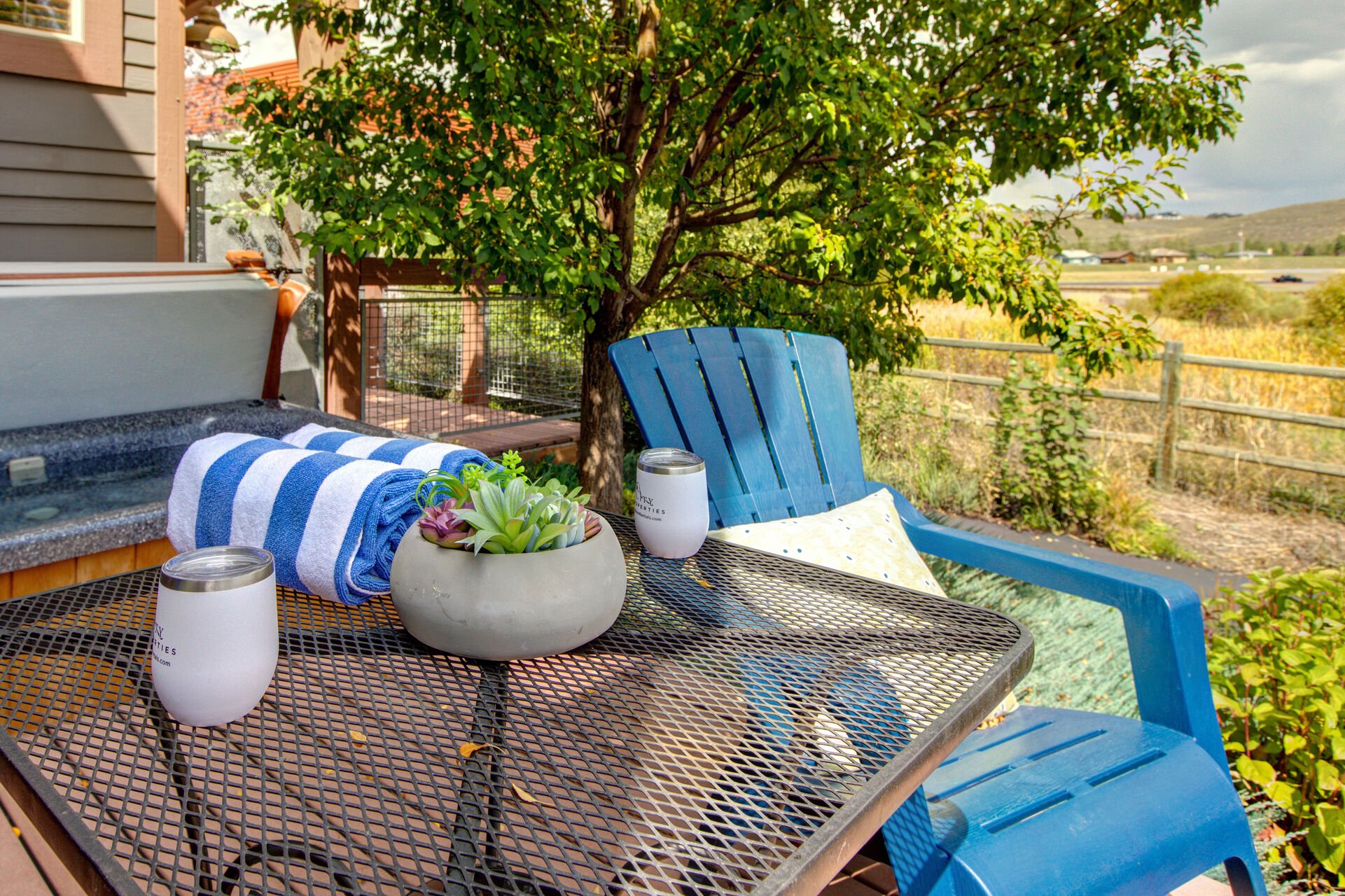 Main Level private patio with hot tub, table and chairs for two, and spectacular surrounding views of the nature preserve and biking/hiking trails