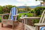 Main Level private patio with hot tub, seating and table for two, and beautiful surrounding views