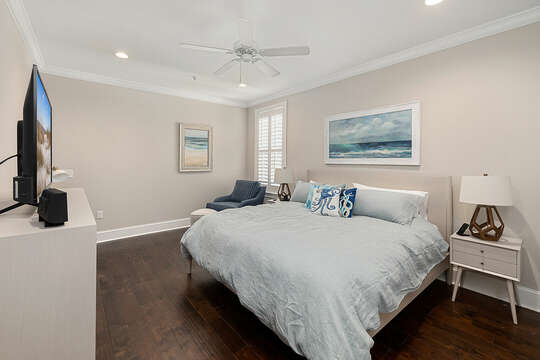 The spacious Master Bedroom includes an HD TV and a writing desk.