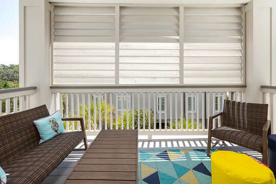 The porch has options for shading out the afternoon sun.