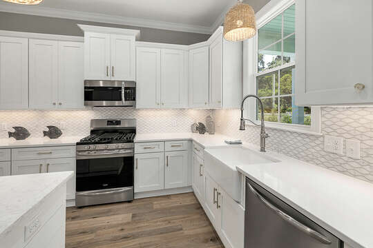 White Kitchen with stainless steel appliances