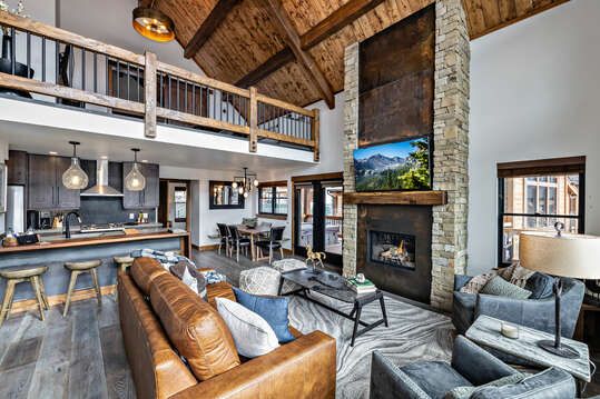 Living room with TV and fireplace