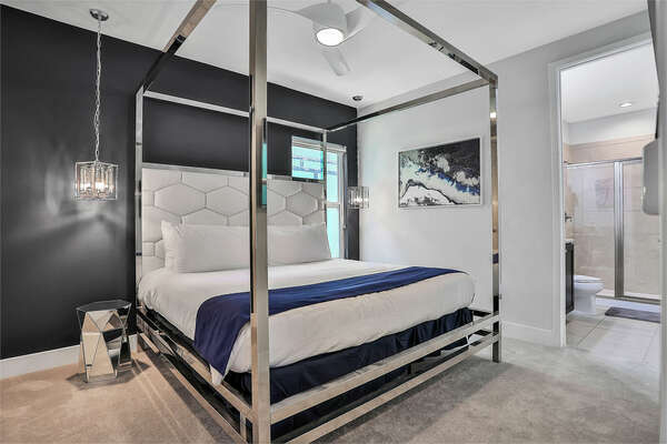 Second-floor bedroom with a king-sized bed and en suite bathroom