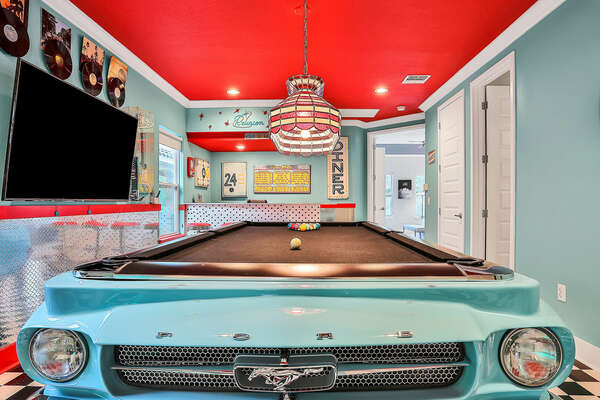 The pool table is an authentic Ford Mustang