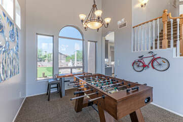 Enjoy foosball competition with a view of the backyard paradise.