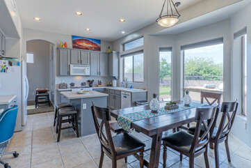 Kitchen opens into a dining area for enjoying home cooked meals or take-out from local restaurants.