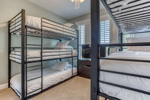 Upper Level Bunk Room with Two Sets of Triple Luxury Twin Bunk Beds
