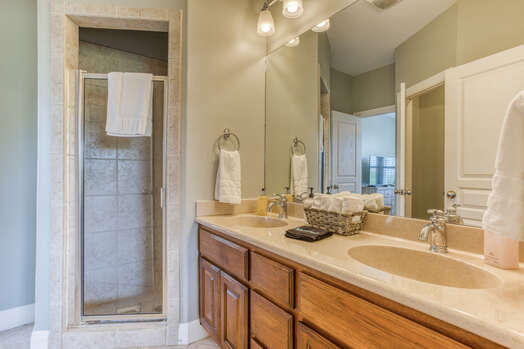 Jack-n-Jill Bath with Dual Sinks and a Tile Shower