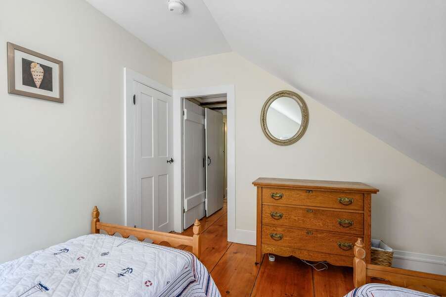 Wide plank wood floors lead back to Bedroom 2 in front and Bathroom 2 to the right - 98 West Road Orleans Cape Cod New England Vacation Rentals