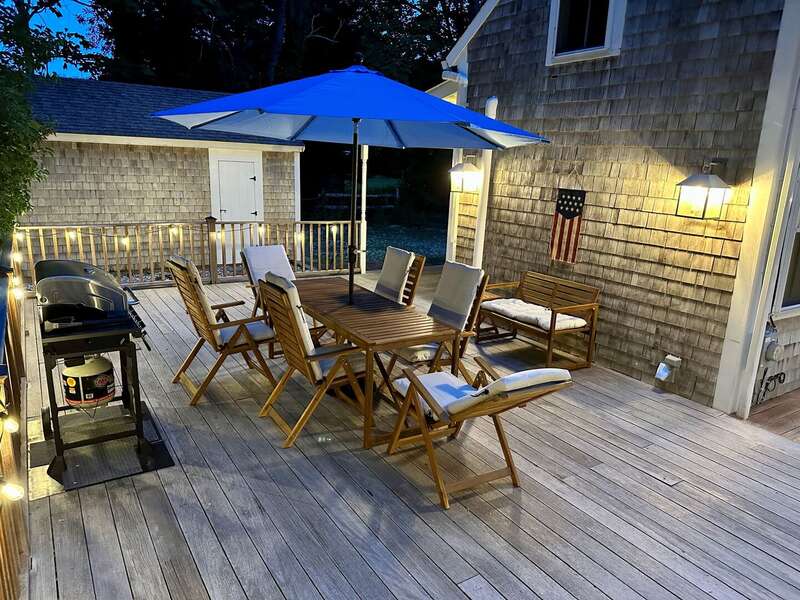 Soft lighting sets the mood at night on the deck - 98 West Road Orleans Cape Cod New England Vacation Rentals