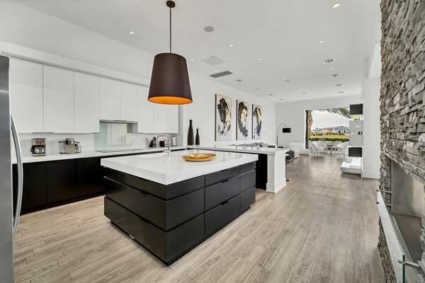 The living room space, kitchen, and dining area have a modern flair