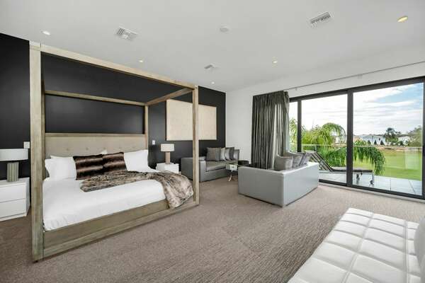 This spacious master suite offers a beautiful view of the golf course