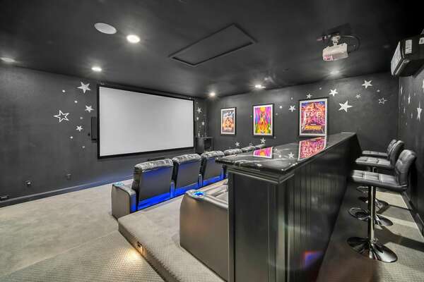 Make some popcorn and host a movie night in the private movie theatre