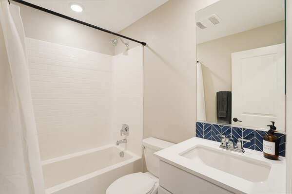 Guest Bedroom En-Suite w/ Tub Shower - 1st Floor