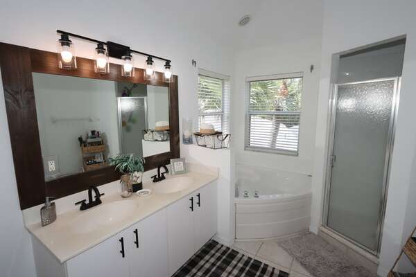 Master Bathroom has double vanity, and separate tub/shower. spaces.