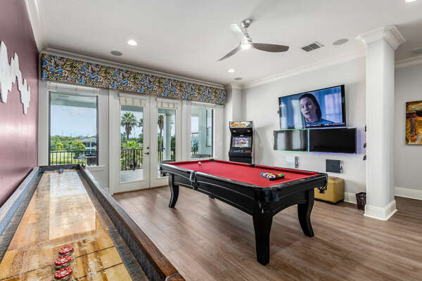 The entertainment loft offers shuffleboard, a billiards table, Xbox One, PS4, and balcony access with a foosball table