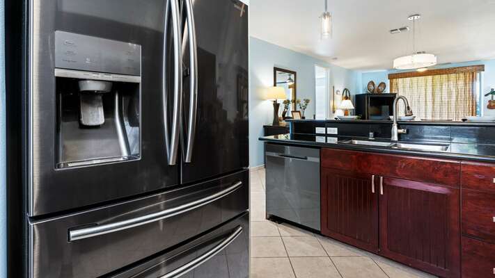 Kitchen is fully equipped and features deluxe stainless-steel appliances