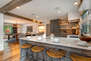 Gourmet Kitchen with Stone Counters and Bar Seating for Four
