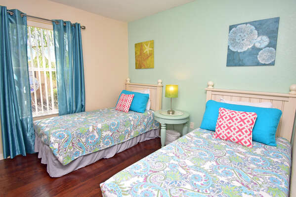 Bedroom 3 has twin beds and a tranquil under the sea vibe
