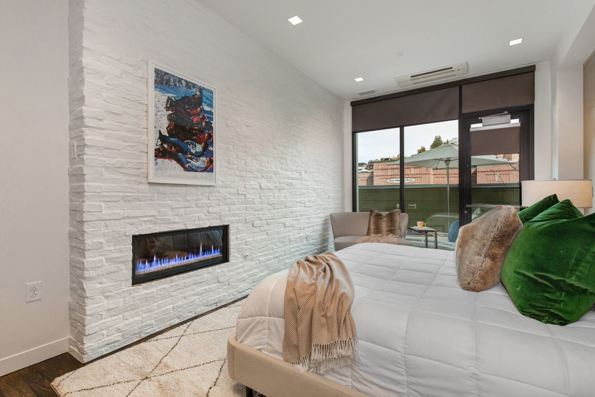 Master Bedroom with a King Bed and Cozy Gas Fireplace