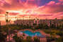Beautiful sunset overlooking complex pool