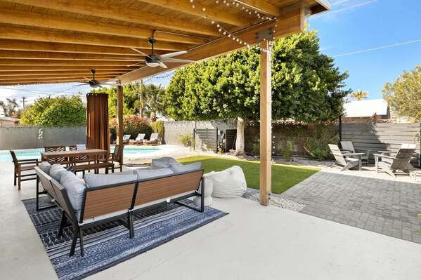 Covered Outdoor Seating Area w/ Pool in Background
