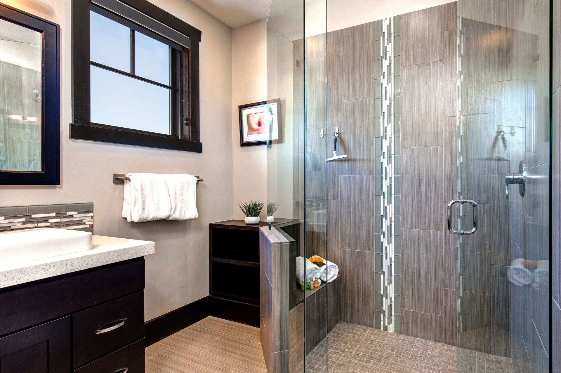 Master Bathroom with two separate vanities and over-sized tile and glass shower