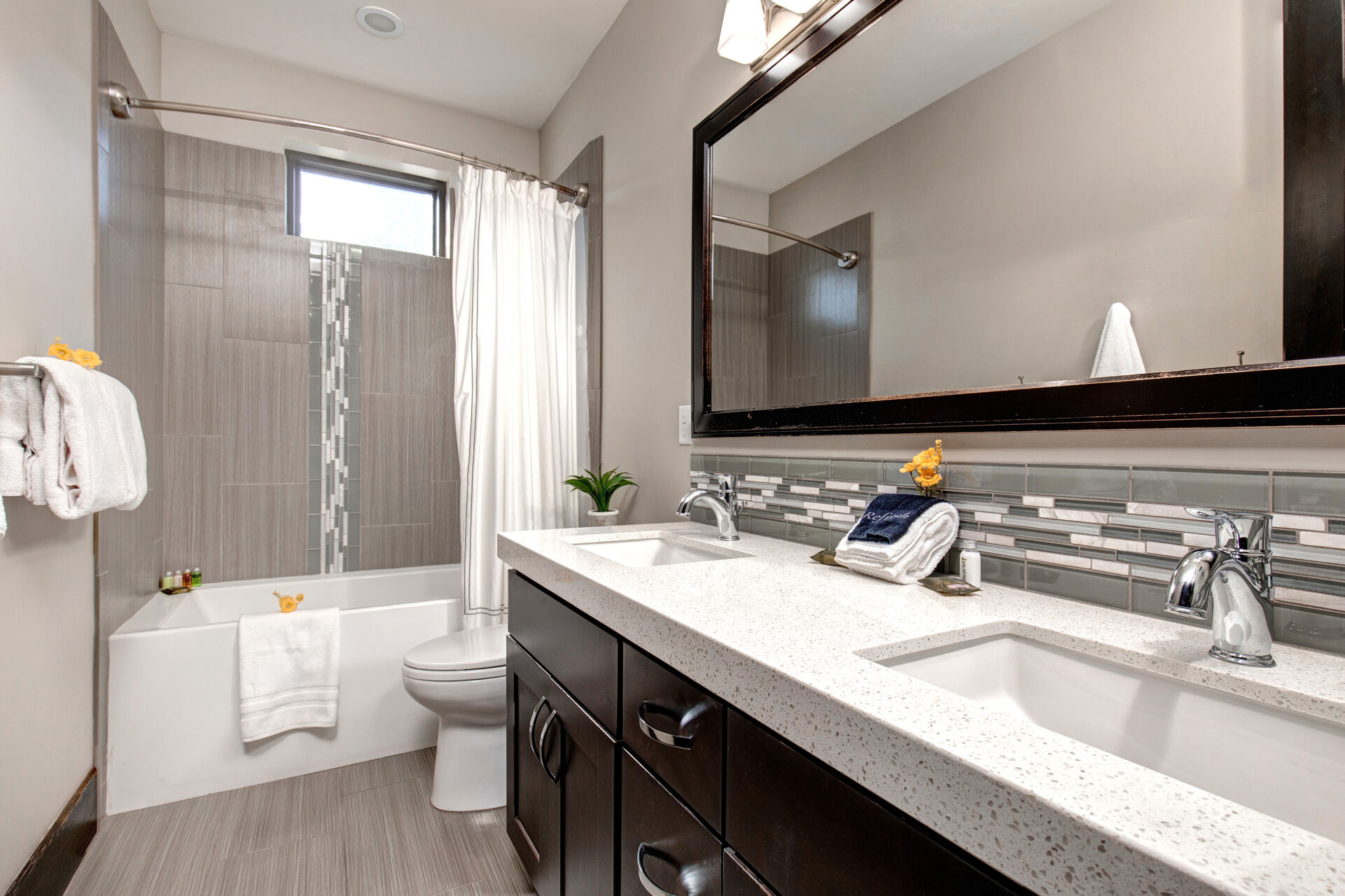 Upper Level Full Bathroom with dual vanities and tub/shower combo