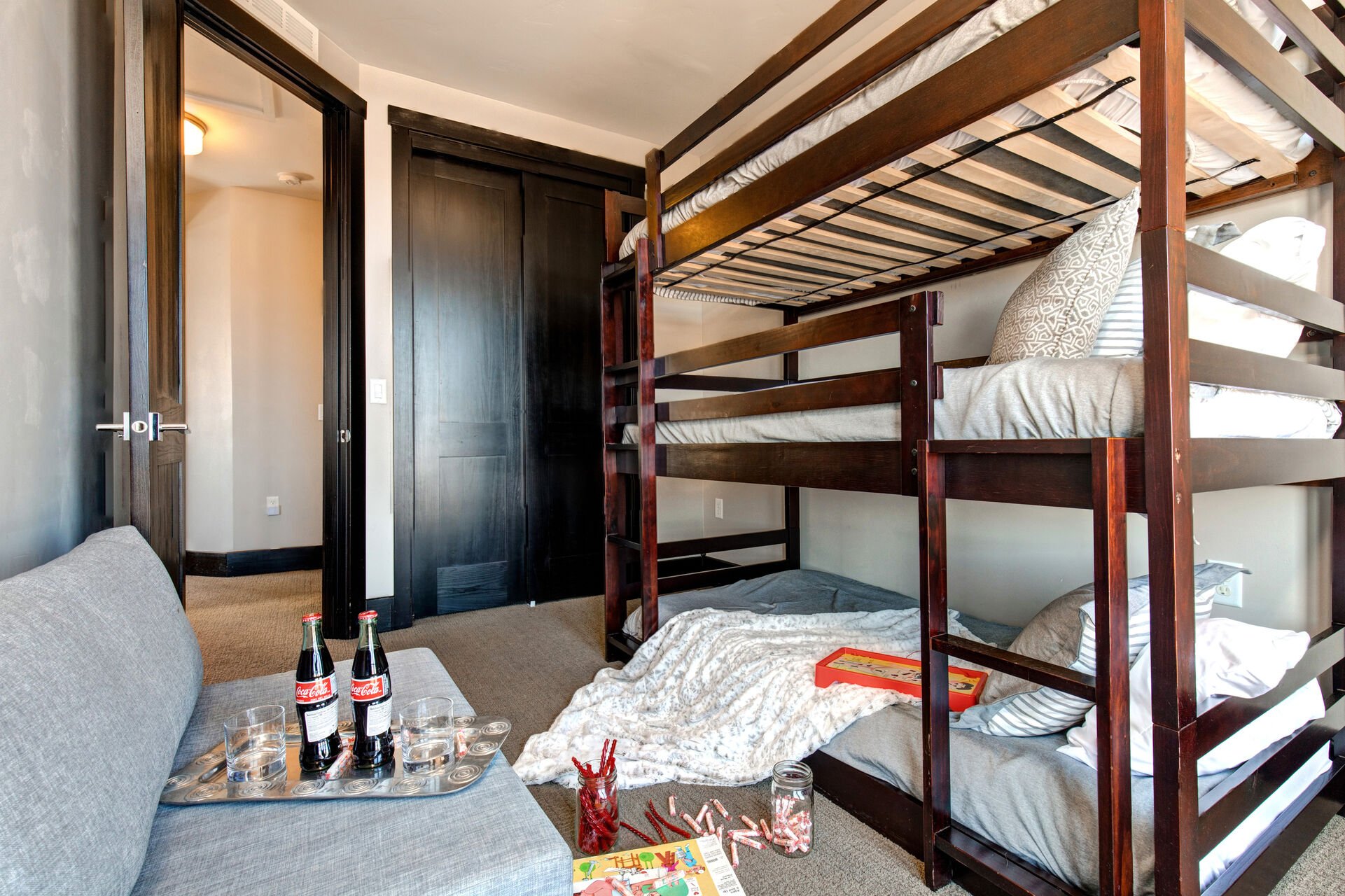 Upper Level Bedroom 3 with twin over twin over twin bunk bed, convertible chair (4th twin bed), private balcony and full bath access
