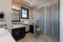 Master Bathroom with two separate vanities and over-sized tile and glass shower