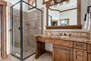 Master Bathroom with double vanities, tiled shower, walk-in closet, and jetted tub
