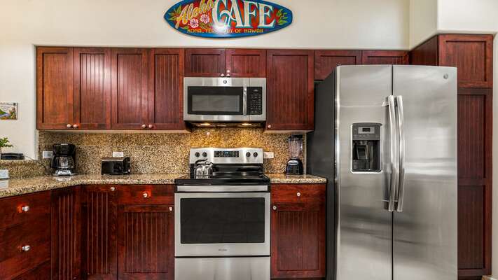 Large fully equipped kitchen with stainless steel appliances