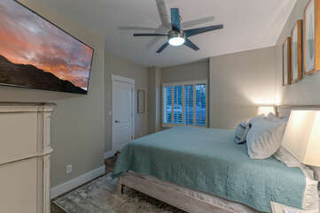 King bed, TV and ceiling fan are the appealing amenities in Bedroom 3.