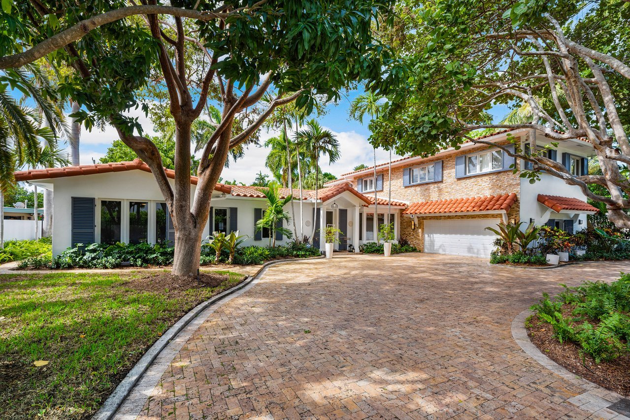 This Spanish Revival ample residence is located in the private  Harbor Beach neighborhood.