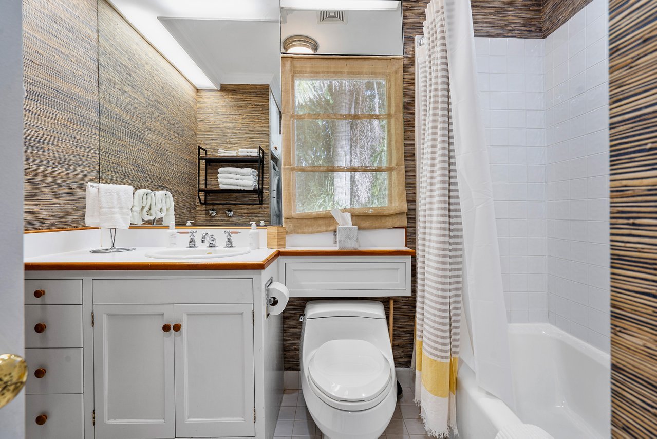 The single bathroom in the MIL suite is shared by both bedrooms, and comes with a tub/shower combo.